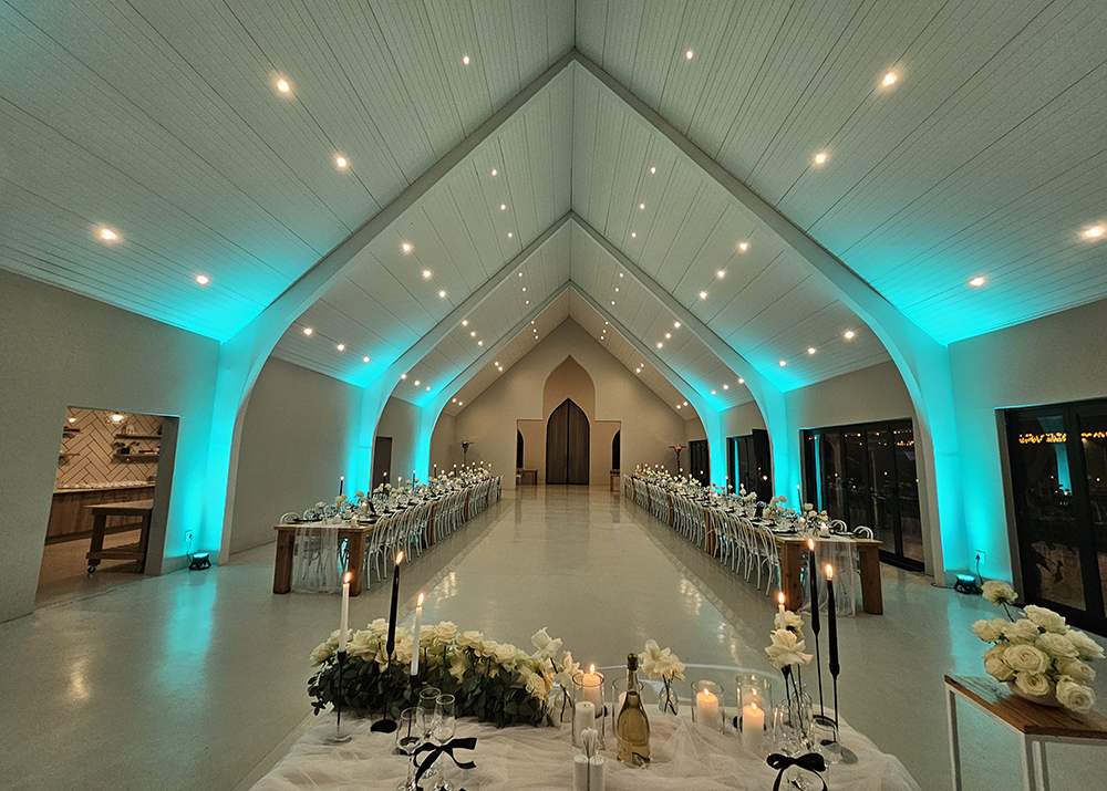 Luxury wedding venue transformed with professional uplighting and ambient lighting design