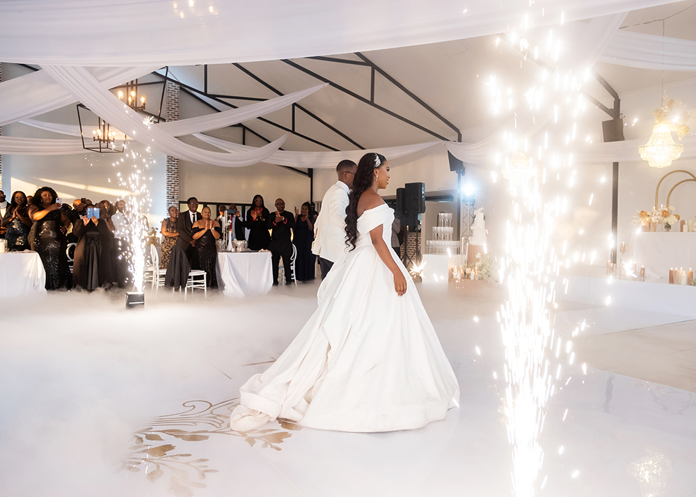 Bride and groom celebrating their first dance with professional cold sparkler effects