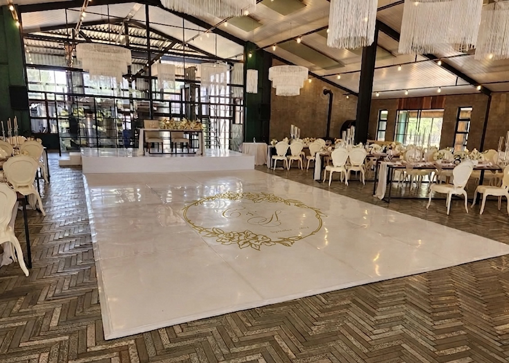 Luxury wedding dance floor vinyl installation at an elegant reception venue