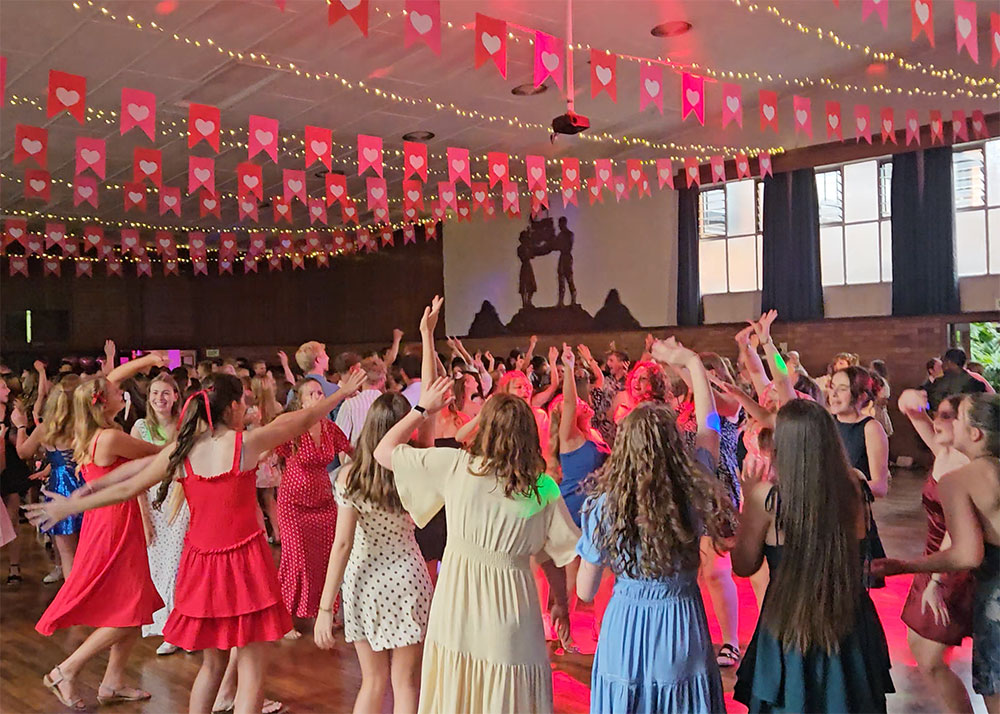 Guests celebrating on the dance floor with professional DJ entertainment at a private event