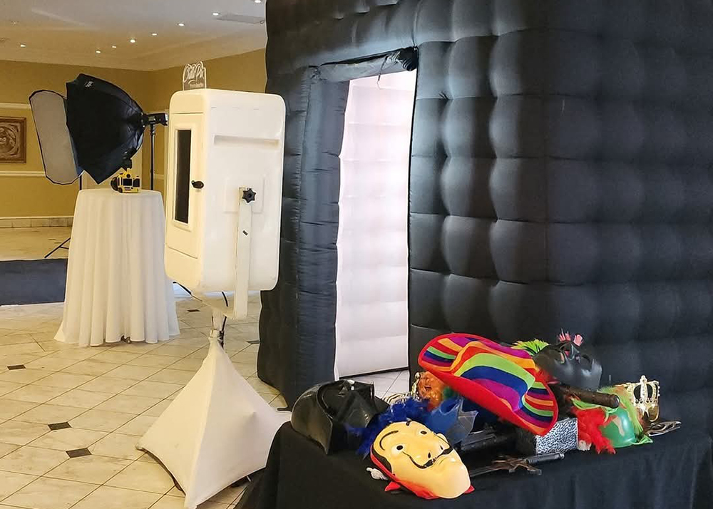 Interactive photo booth entertainment at a private event by Cream Cheese Premier DJs & Events