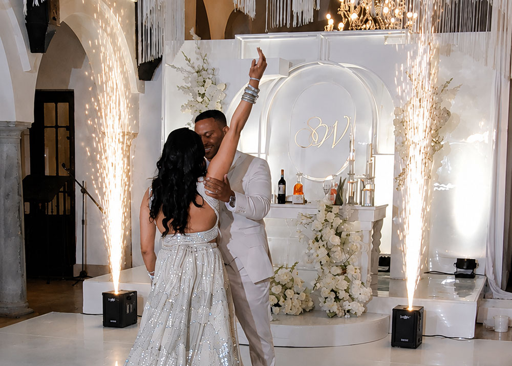 Bride and groom celebrating their wedding with luxury cold sparkler effects and professional entertainment