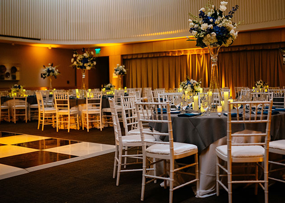 Private event venue transformed with professional uplighting and ambient lighting design