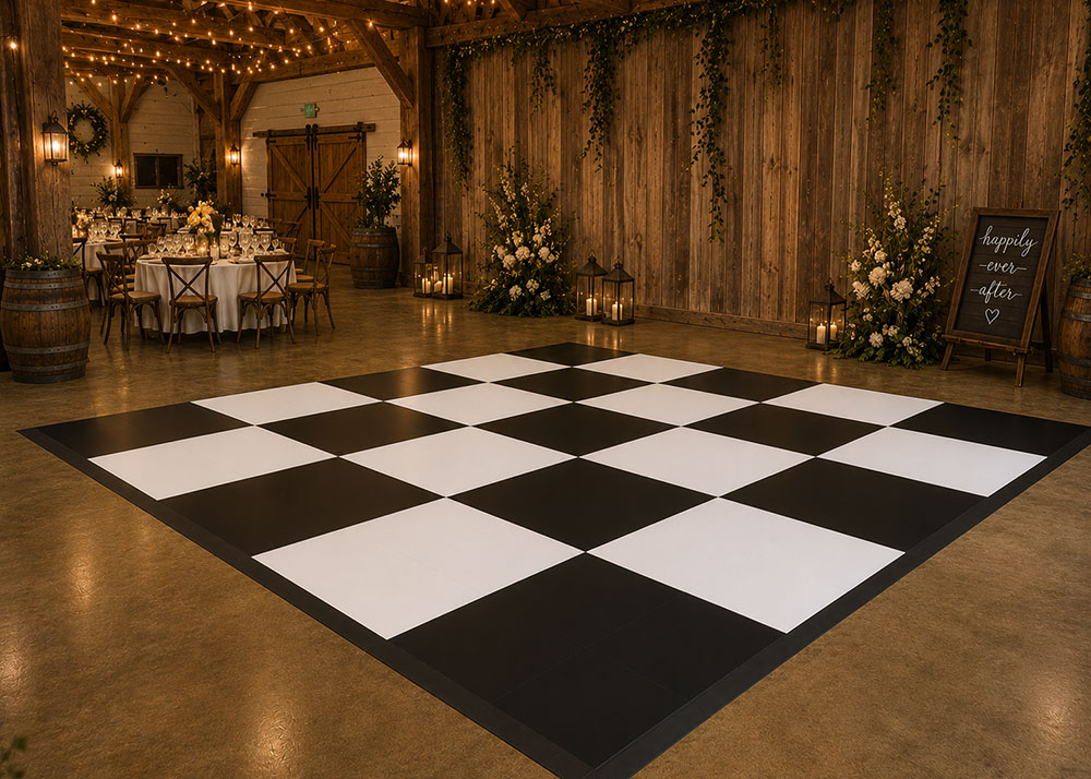 Luxury black and white dance floor installation at an elegant wedding reception venue